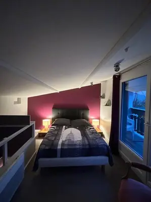 Un ou plusieurs lits dans un hébergement de l'établissement Le chalet sous les arbres