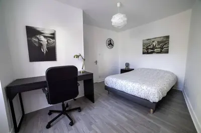 Un ou plusieurs lits dans un hébergement de l'établissement PICH Grande maison centre-ville