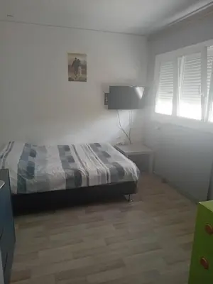 Un ou plusieurs lits dans un hébergement de l'établissement Maison proche du circuit des 24h du Mans