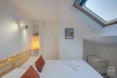 Un ou plusieurs lits dans un hébergement de l'établissement Appartement moderne - Quartier Des Halles - Wifi
