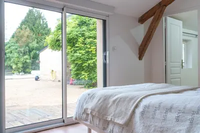 Un ou plusieurs lits dans un hébergement de l'établissement Maison centre Bourgueil avec piscine 8 p