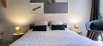 Un ou plusieurs lits dans un hébergement de l'établissement Le studio de la Pouletterie