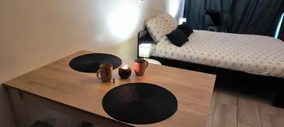 Un ou plusieurs lits dans un hébergement de l'établissement Le studio de la Pouletterie