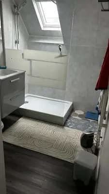 Un ou plusieurs lits dans un hébergement de l'établissement Chambre en maison chez l habitant