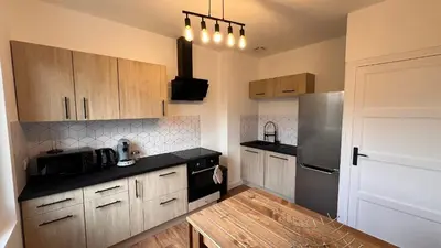 Cuisine ou kitchenette dans l'établissement Le Refuge en Chêne