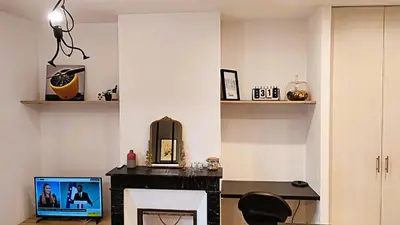 Télévision ou salle de divertissement dans l'établissement Le Douillet Cocon - Centre