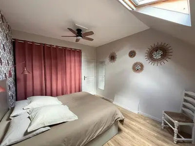 Un ou plusieurs lits dans un hébergement de l'établissement Gîte cosy tout confort - Le palmier