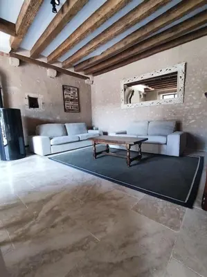 Coin salon dans l'établissement Maison de campagne