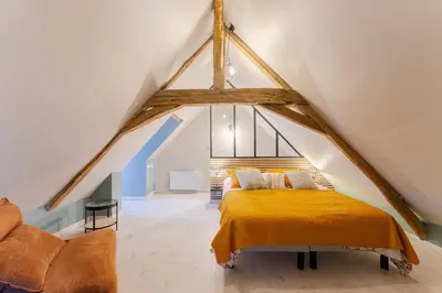 Un ou plusieurs lits dans un hébergement de l'établissement Gite de la ferme du château 1 - Appt climatisé