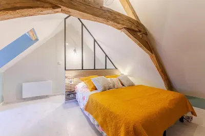 Un ou plusieurs lits dans un hébergement de l'établissement Gite de la ferme du château 1 - Appt climatisé
