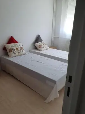 Un ou plusieurs lits dans un hébergement de l'établissement appartement lumineux