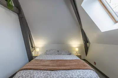 Un ou plusieurs lits dans un hébergement de l'établissement La maison du centre