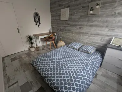 Un ou plusieurs lits dans un hébergement de l'établissement Appartement idéal circuit des 24h du Mans