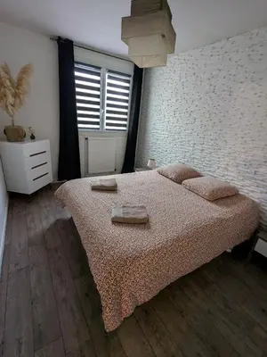 Un ou plusieurs lits dans un hébergement de l'établissement Appartement idéal circuit des 24h du Mans