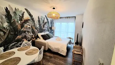 Un ou plusieurs lits dans un hébergement de l'établissement Appartement cosy, balcon et place privée