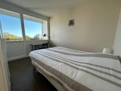 Un ou plusieurs lits dans un hébergement de l'établissement Appartement lumineux 3 chambres à Tours nord