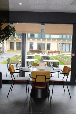 Restaurant ou autre lieu de restauration dans l'établissement Résidence Montana Le Mans