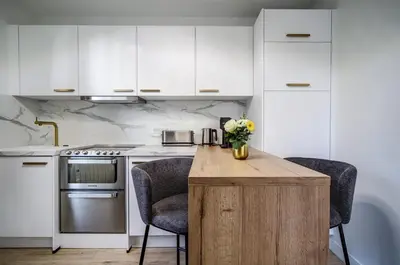 Cuisine ou kitchenette dans l'établissement La Suite du Roi Henri