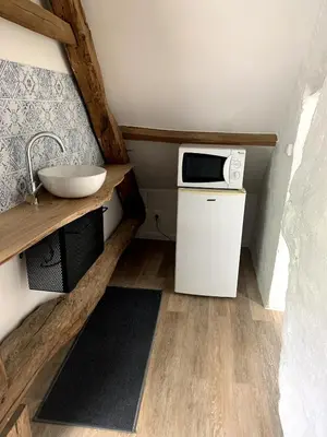 Cuisine ou kitchenette dans l'établissement Le petit bois mayetais