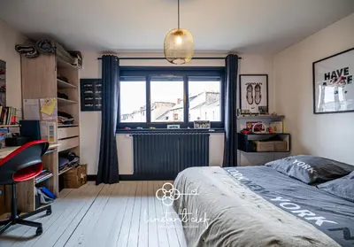 Un ou plusieurs lits dans un hébergement de l'établissement Maison avec terrasse parfaite pour les 24H et GP Moto