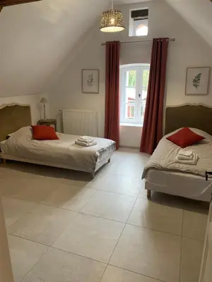 Un ou plusieurs lits dans un hébergement de l'établissement Domaine de la Garnauderie Gîte des Chênes