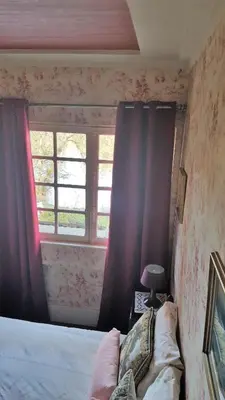 Un ou plusieurs lits dans un hébergement de l'établissement Le Manoir du coeur volant B&B