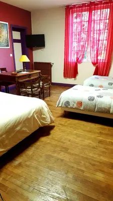 Un ou plusieurs lits dans un hébergement de l'établissement Le Manoir du coeur volant B&B