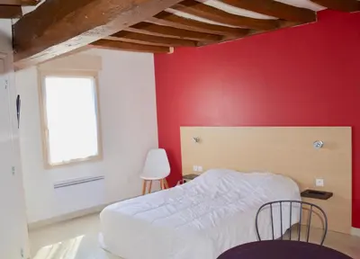 Un ou plusieurs lits dans un hébergement de l'établissement La Petite Maison appartement 1