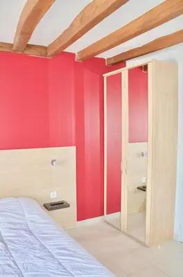Un ou plusieurs lits dans un hébergement de l'établissement La Petite Maison appartement 1