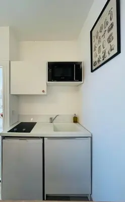 Cuisine ou kitchenette dans l'établissement Appartement charmant proche Gare