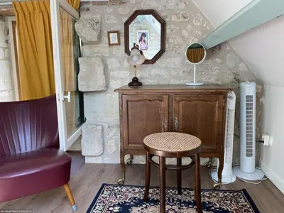 Coin salon dans l'établissement Le Refuge des Châteaux