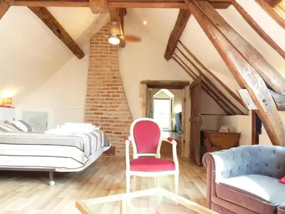 Un ou plusieurs lits dans un hébergement de l'établissement Le Plessis, Stone Farmhouse Loft with Gardens and Pool