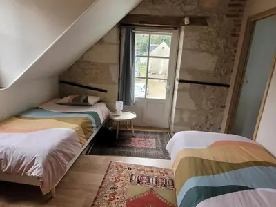Un ou plusieurs lits dans un hébergement de l'établissement Gîte de charme aux portes d'Amboise avec grand jardin et Wi-Fi - FR-1-381-604