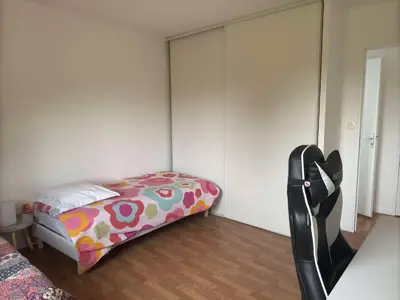 Un ou plusieurs lits dans un hébergement de l'établissement Maison de 82m2 proche du Mans avec parking privé