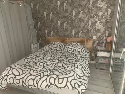 Un ou plusieurs lits dans un hébergement de l'établissement Maison de plein pied à Arnage proche du circuit