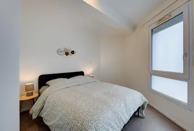 Un ou plusieurs lits dans un hébergement de l'établissement Appartement Cosy proche Gare