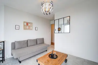 Coin salon dans l'établissement Appartement Cosy proche Gare