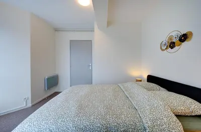 Un ou plusieurs lits dans un hébergement de l'établissement Appartement Cosy proche Gare