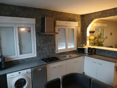 Cuisine ou kitchenette dans l'établissement Bienvenue