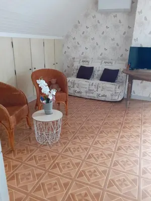 Un ou plusieurs lits dans un hébergement de l'établissement La chambre aux papillons
