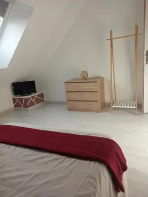 Un ou plusieurs lits dans un hébergement de l'établissement Location 24h du Mans