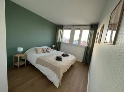 Un ou plusieurs lits dans un hébergement de l'établissement Appartement de la Famille Chat