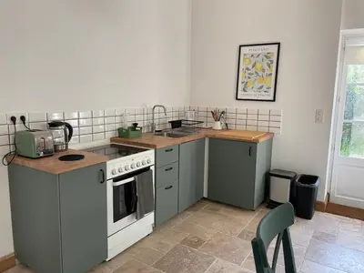 Cuisine ou kitchenette dans l'établissement Ancienne grange rénové et cozy le long de la rivière du Cher