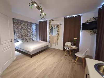 Un ou plusieurs lits dans un hébergement de l'établissement Studio Kamelia