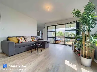 Coin salon dans l'établissement Appartement au bord du lac