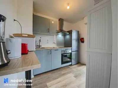 Cuisine ou kitchenette dans l'établissement Appartement au bord du lac