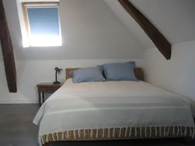 Un ou plusieurs lits dans un hébergement de l'établissement Loft du Petit Bois