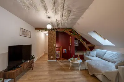 Télévision ou salle de divertissement dans l'établissement Le Grand Cru - Centre Ville