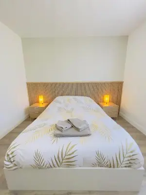 Un ou plusieurs lits dans un hébergement de l'établissement Le Luxury Lodge - 8 Voyageurs - Parking et Wifi