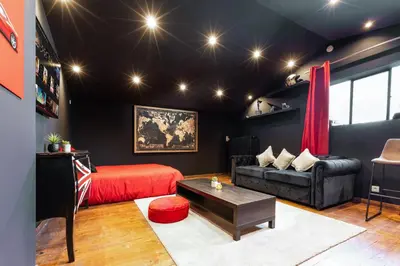 Coin salon dans l'établissement Loft 8 Chic et Cosy - WIFI - Arnage